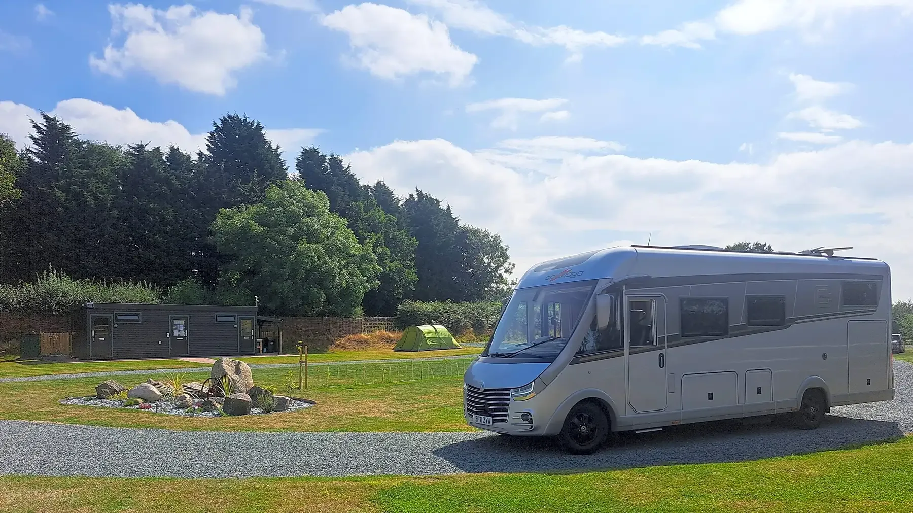Off-grid grass camping pitch at Willows